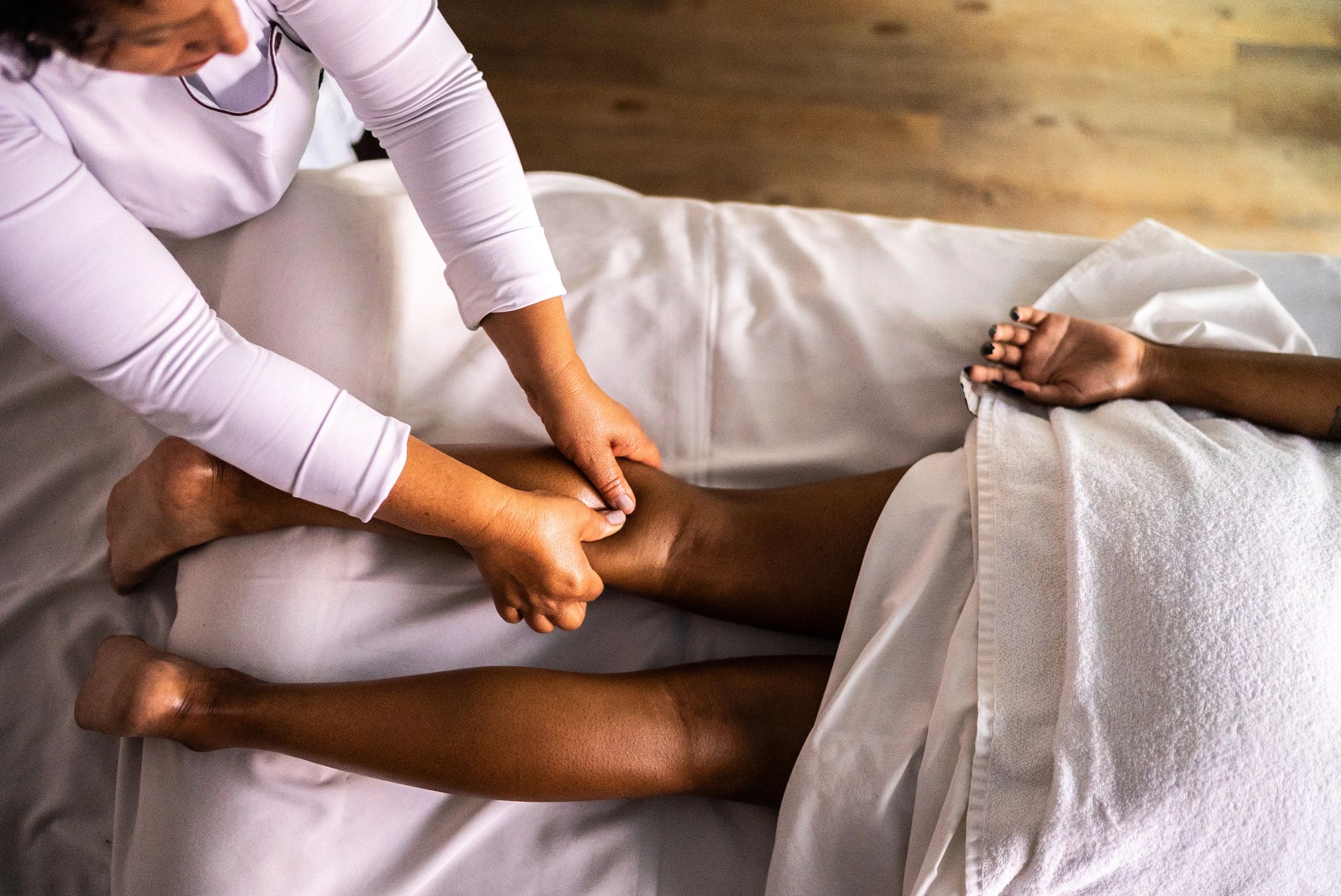 Therapist providing targeted bodywork for recovery and performance